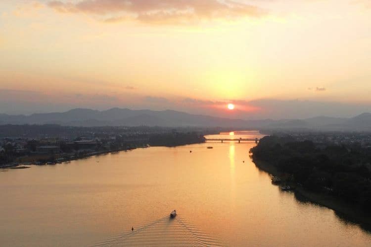Hue draped in sunset hues