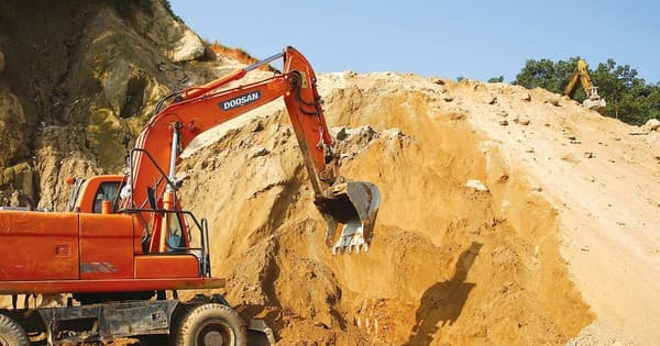How are taxes and fees applied to land excavation for construction? 
