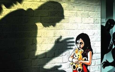 Man arrested for molesting seven-year-olds in child’s school