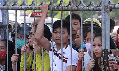 Vietnam health facility overwhelmed by vaccination registrations amidst side-effects scare