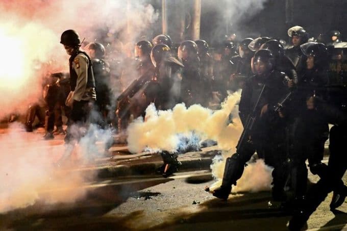 Indonesian police fire tear gas to break up election protest