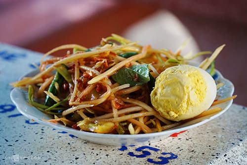 Try the explosion of flavors that is Khmer mixed papaya salad
