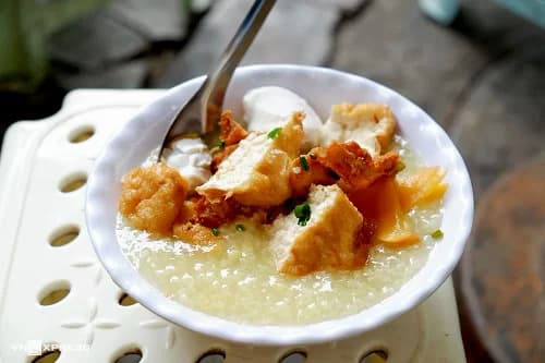 Bean porridge with tofu, pickled eggplants in Hanoi's Old Quarter