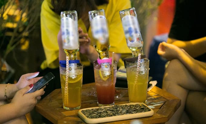 Overturned beer bottle in mojito, Hanoi's new nightly fix