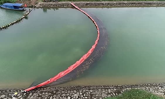 Oil filters installed on canal flowing into water treatment plant