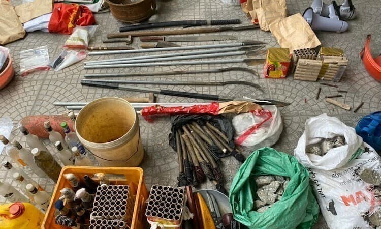 20 investigated for murder in clash with Hanoi police
