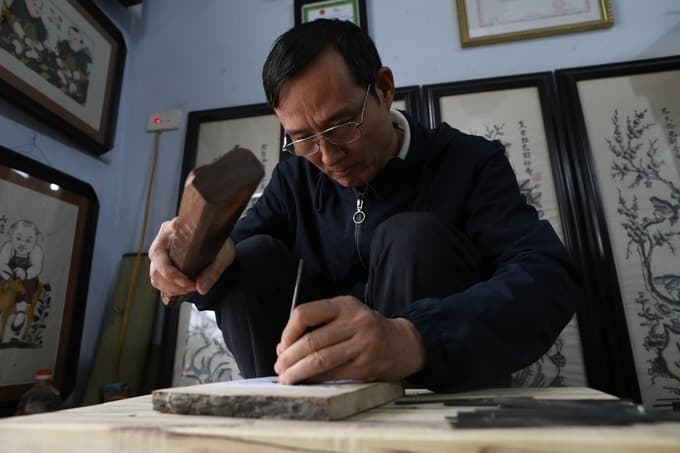 "Rat’s Weddings" galore as Vietnamese woodcut artist prepares for Tet