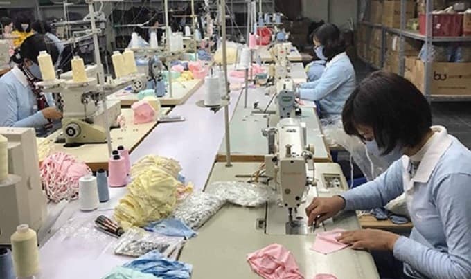 Mask producers warn raw material shortage could hit supply