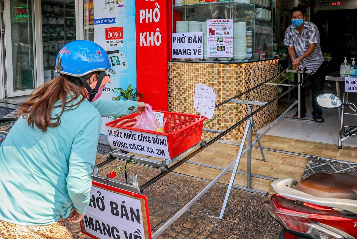Saigon eateries innovate to keep their distance