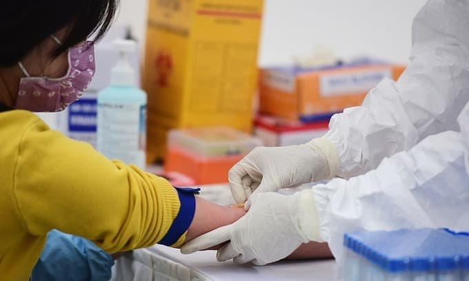 15,000 associated with virus-hit Hanoi hospital test Covid-19 negative