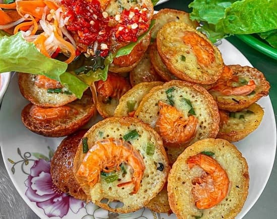One-cent shrimp pancakes sizzle up Saigon street food scene