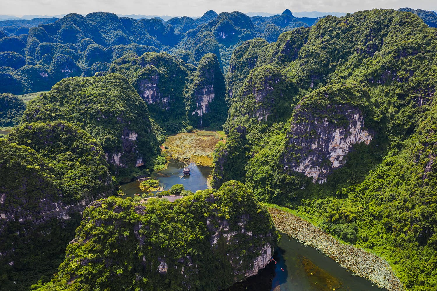 Limestone rich Trang An draws tourists with ancient allure