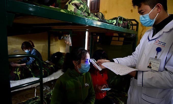 Vietnam cuts Covid-19 quarantine period back to 14 days