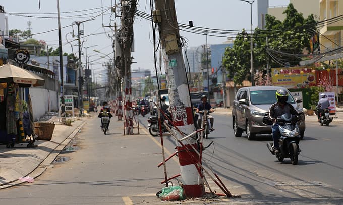 80 power poles left in the middle of Saigon street