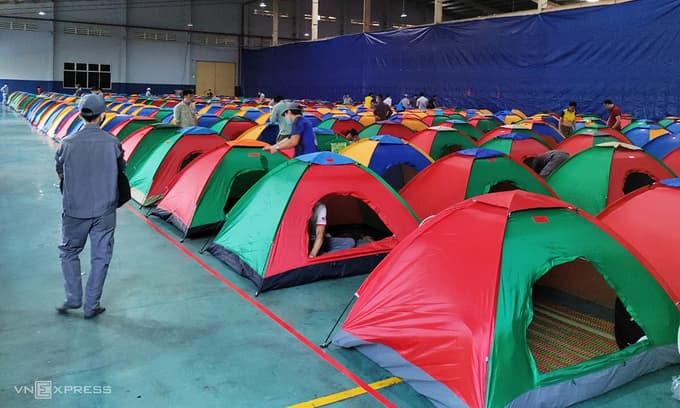 Individual tents mushroom in southern factories to house workers